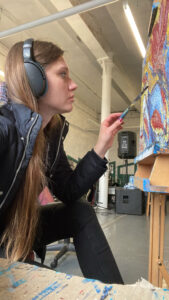 Karolina painting at her studio in Belfast